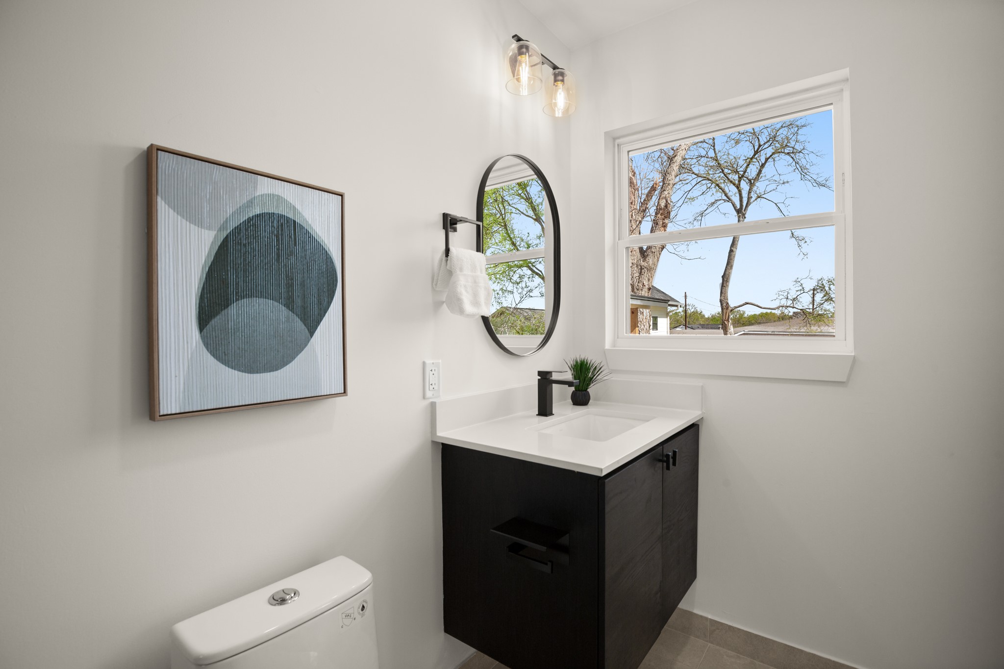 3308 Touchstone Street Austin, TX 78723 - Photo 14 of 38 Half bathroom featuring vanity and toilet