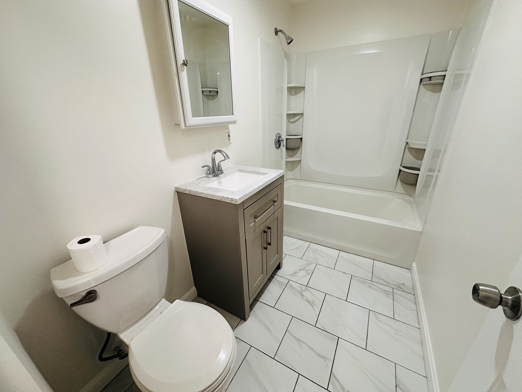 35-37 Suffolk Street Springfield, MA 01109 - Photo 13 of 17 a bathroom with a sink a toilet and shower