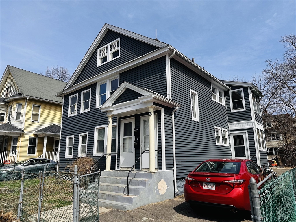 35-37 Suffolk Street Springfield, MA 01109 - Photo 2 of 17 a front view of a house with a yard