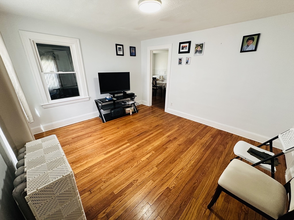 35-37 Suffolk Street Springfield, MA 01109 - Photo 3 of 17 a bedroom with a bed and a flat screen tv