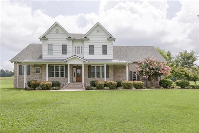 302 Barbara Spears Road Morrison, TN 37357 - Photo 1 of 16 a front view of a house with garden