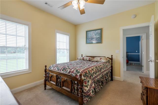 302 Barbara Spears Road Morrison, TN 37357 - Photo 13 of 16 a bedroom with a bed window and a chandelier