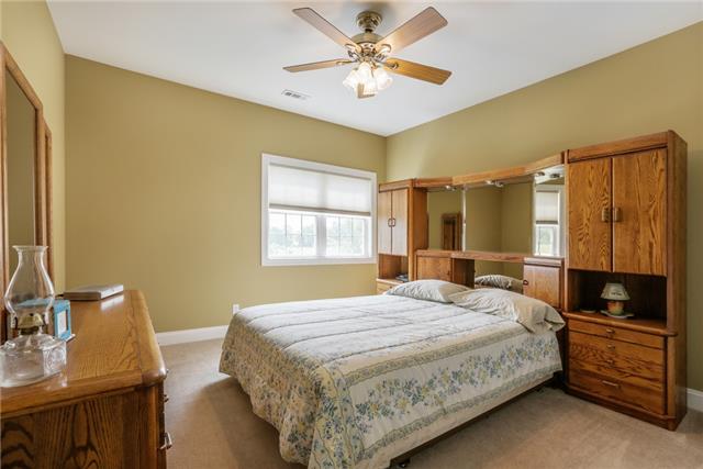 302 Barbara Spears Road Morrison, TN 37357 - Photo 14 of 16 a bedroom with a bed and a table with the dresser