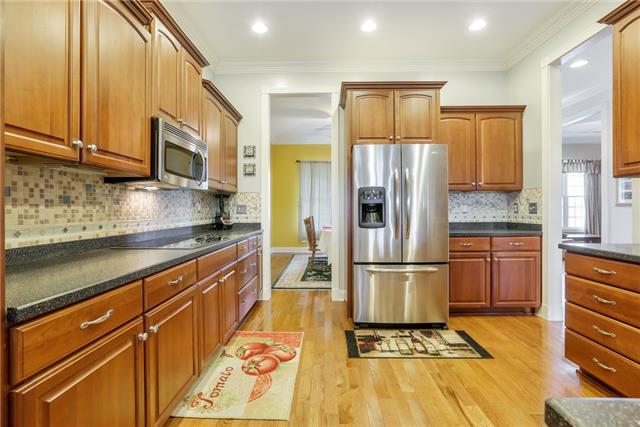 302 Barbara Spears Road Morrison, TN 37357 - Photo 6 of 16 a kitchen with stainless steel appliances granite countertop a refrigerator stove and sink