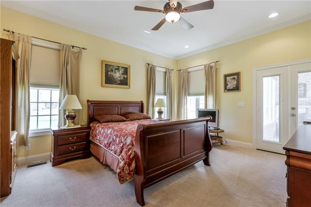 302 Barbara Spears Road Morrison, TN 37357 - Photo 10 of 16 a bedroom with a bed and a chandelier