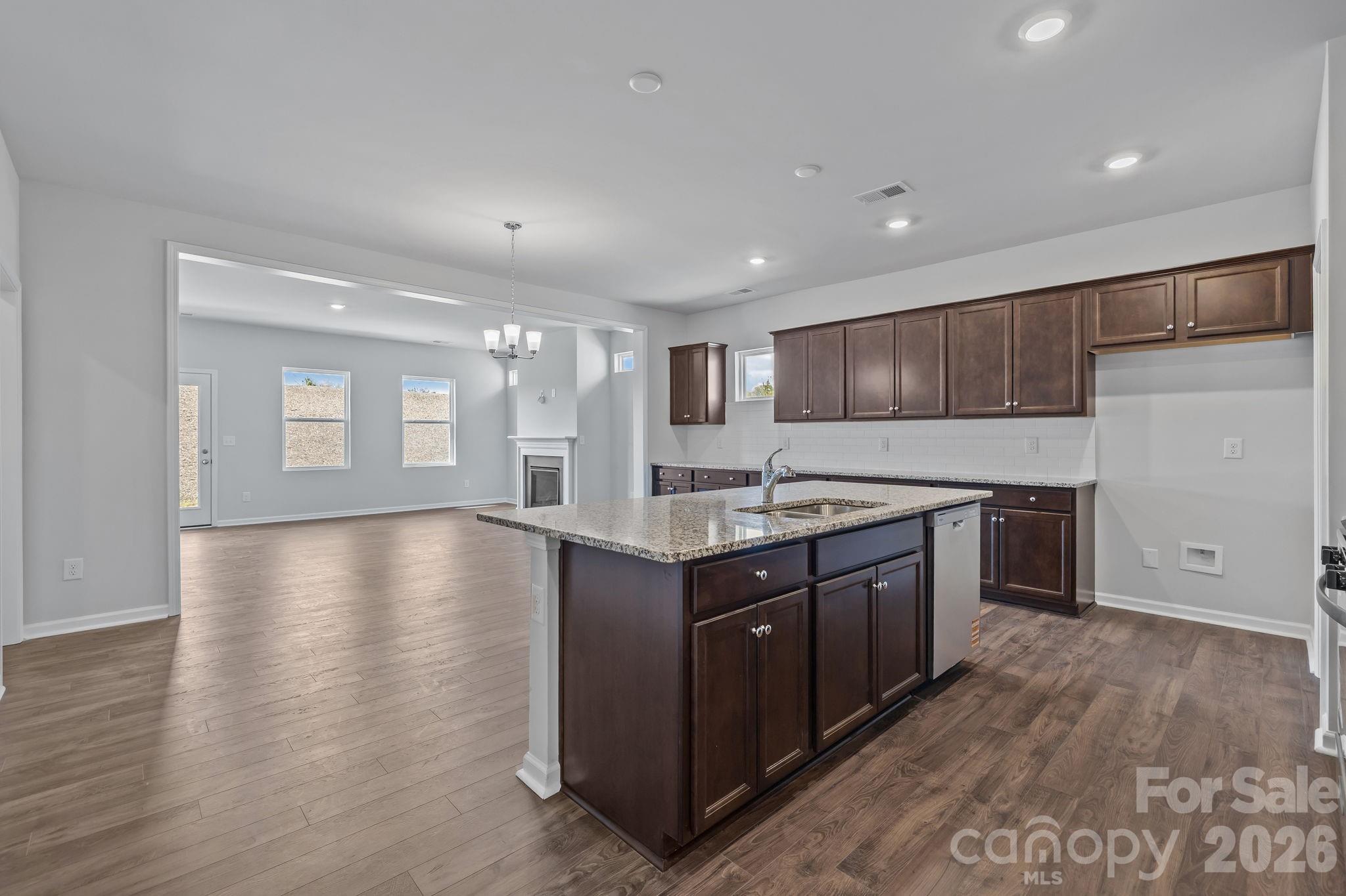 454 Brick House Road York, SC 29745 - Photo 13 of 35 a kitchen with stainless steel appliances granite countertop a stove a sink and a refrigerator