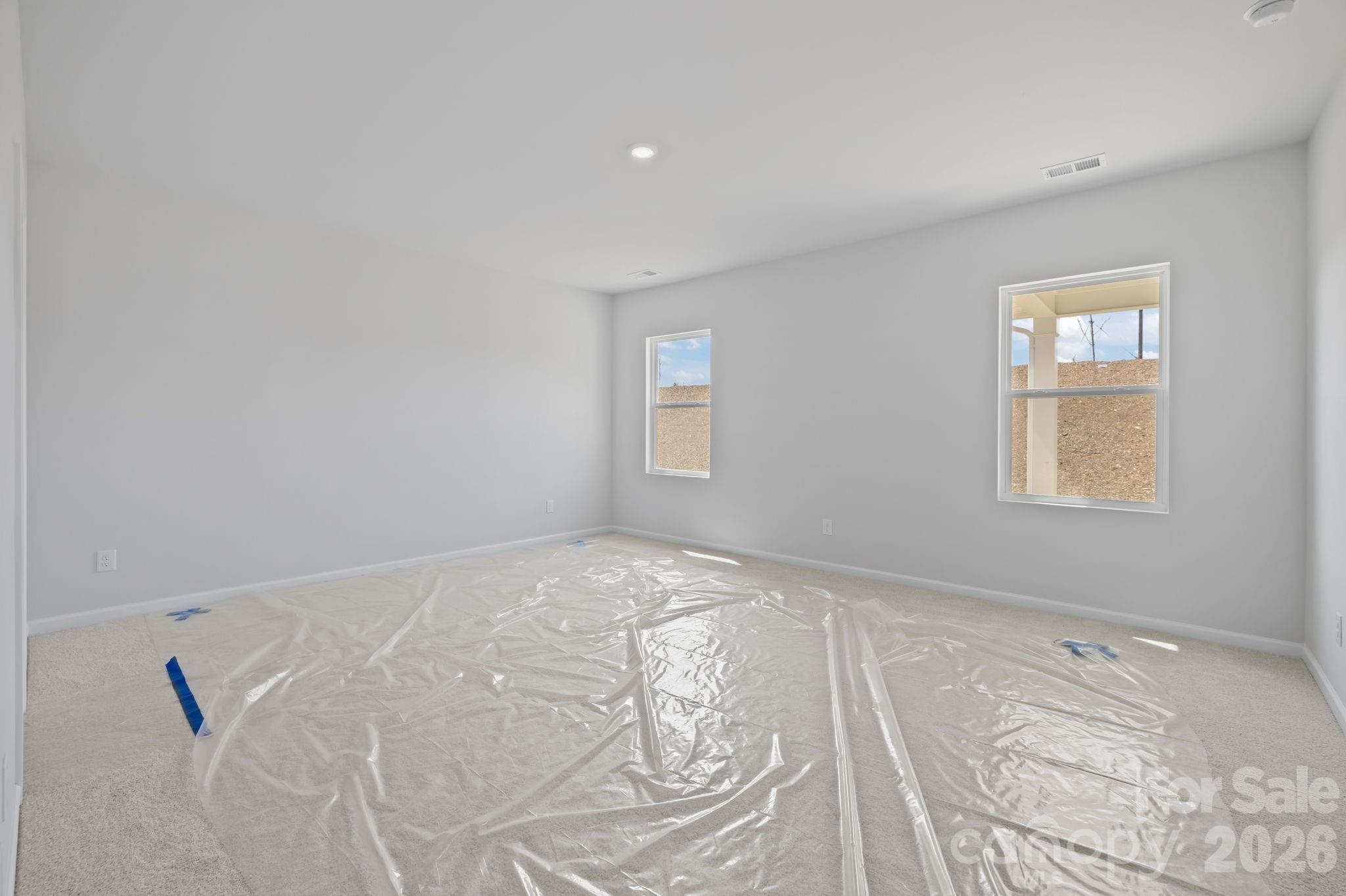 454 Brick House Road York, SC 29745 - Photo 21 of 35 an empty room with a white bed and a window