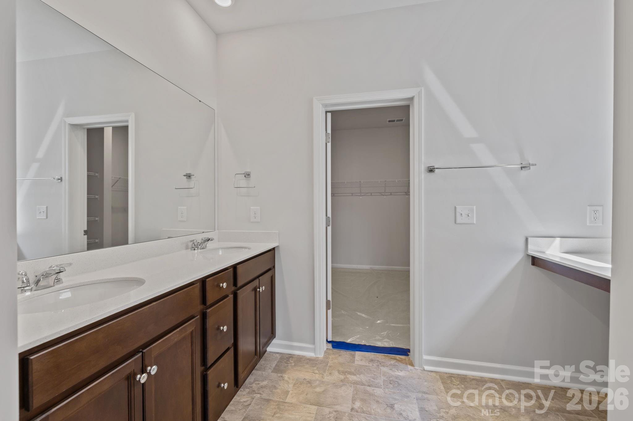454 Brick House Road York, SC 29745 - Photo 23 of 35 a bathroom with a sink a mirror and a shower