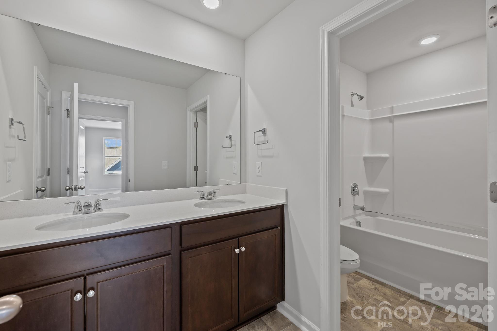 454 Brick House Road York, SC 29745 - Photo 28 of 35 a bathroom with a tub sink double and mirror