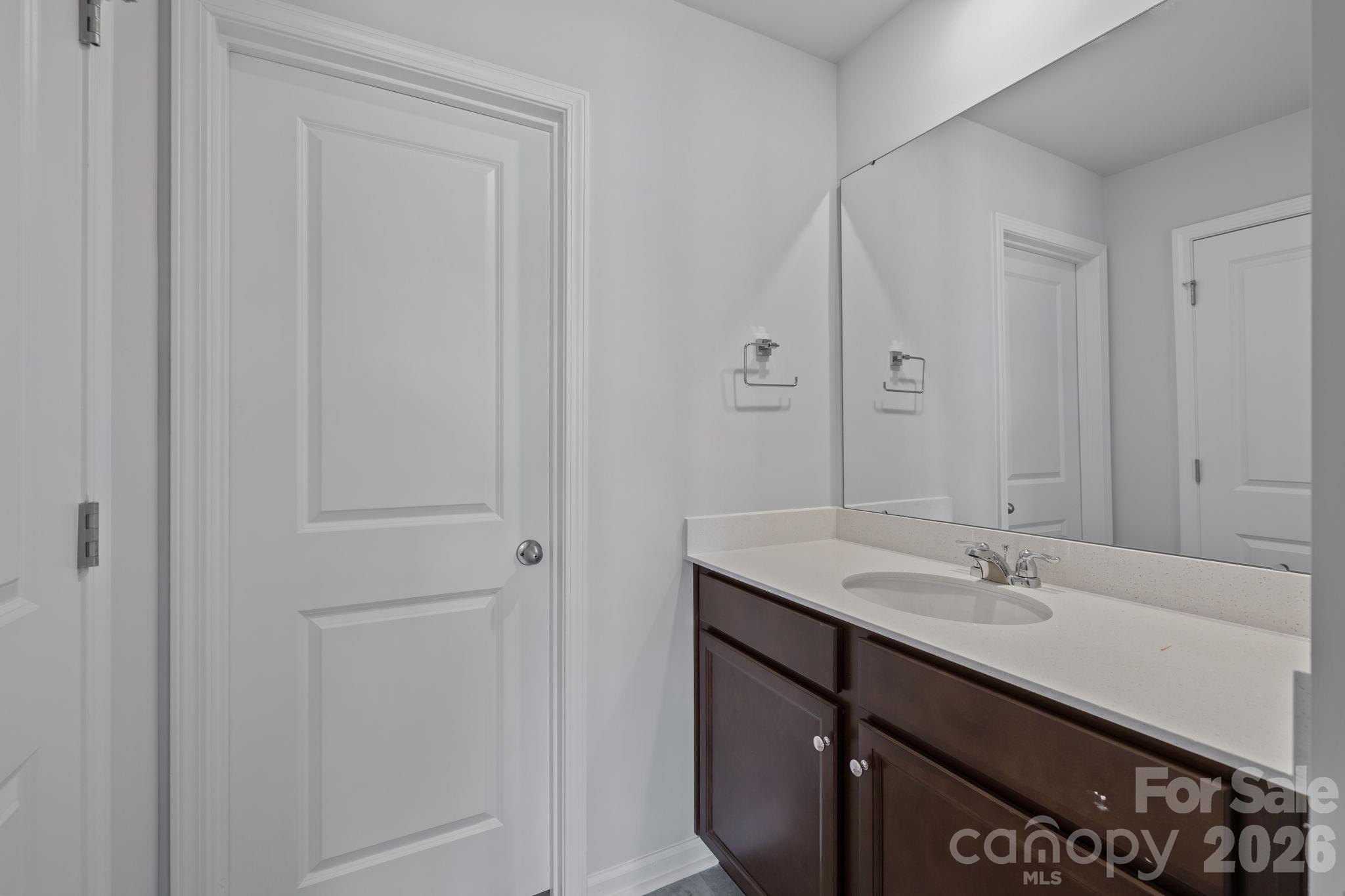 454 Brick House Road York, SC 29745 - Photo 31 of 35 a bathroom with a sink and a mirror
