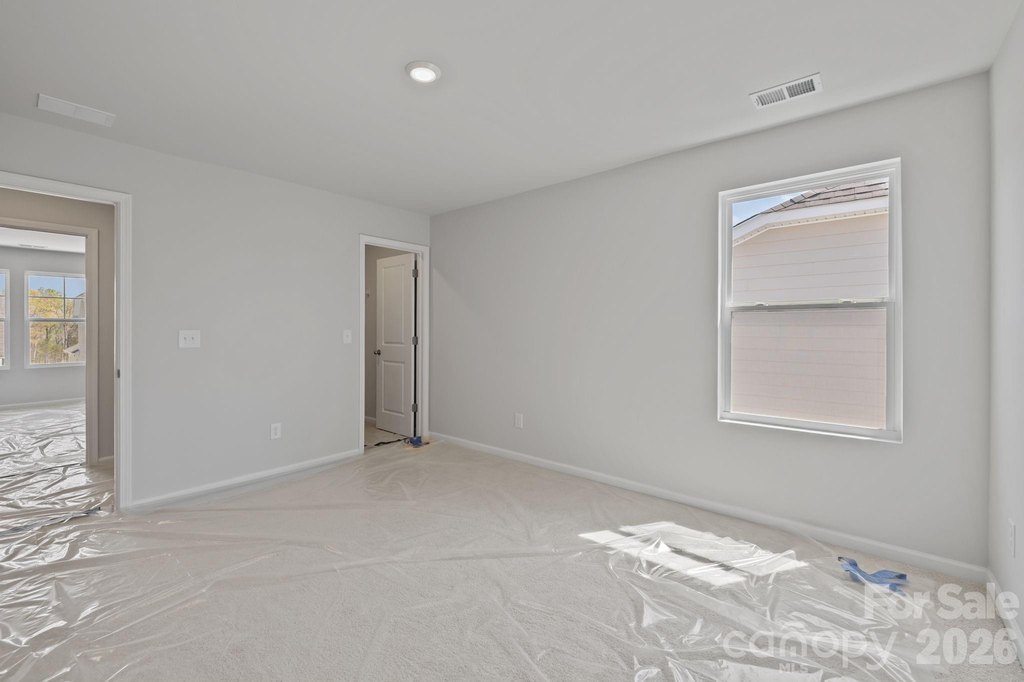 454 Brick House Road York, SC 29745 - Photo 35 of 35 a view of an empty room with wooden floor and a window