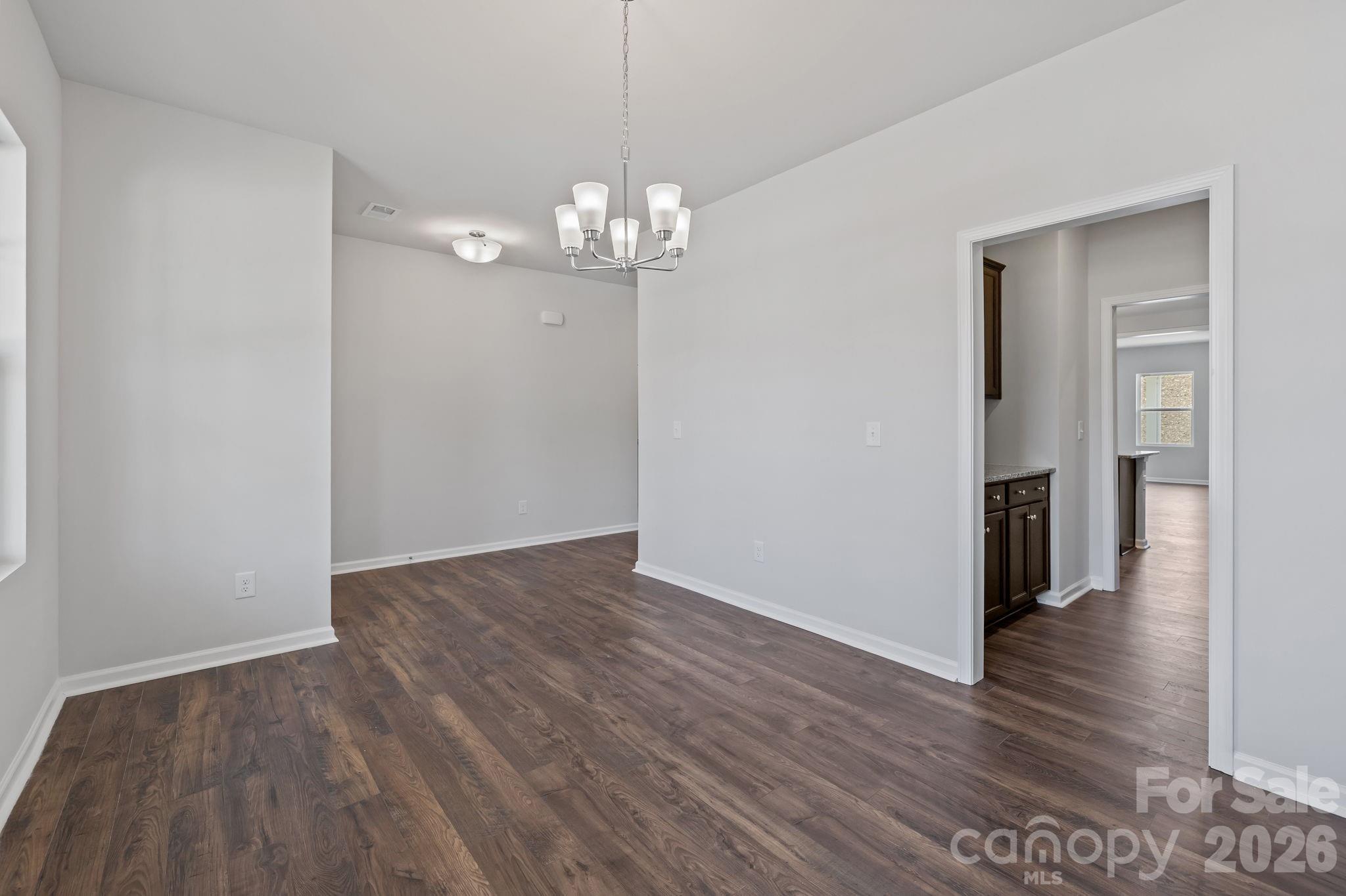 454 Brick House Road York, SC 29745 - Photo 10 of 35 wooden floor in an empty room with a window