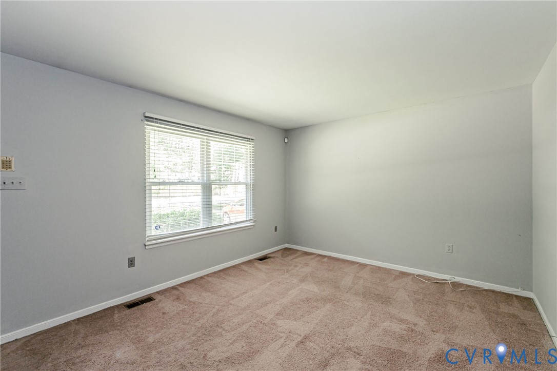 709 Deter Road Richmond, VA 23225 - Photo 3 of 38 Carpeted room with a window featuring horizontal b