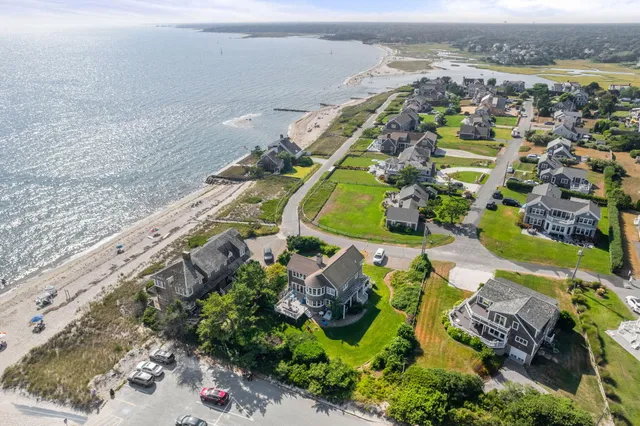 an aerial view of a house with a swimming pool