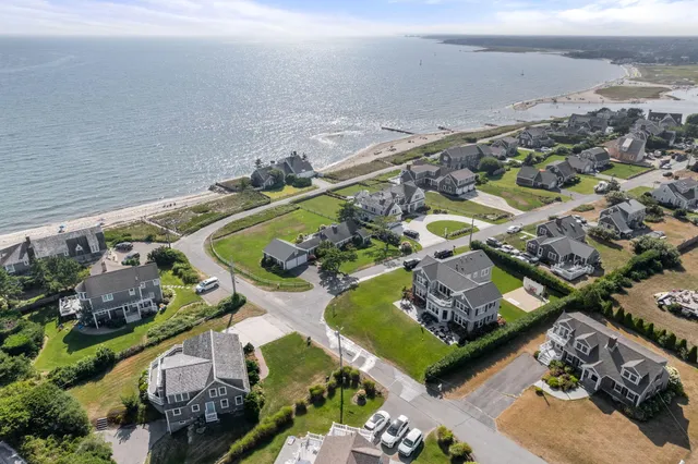 an aerial view of a house with a swimming pool