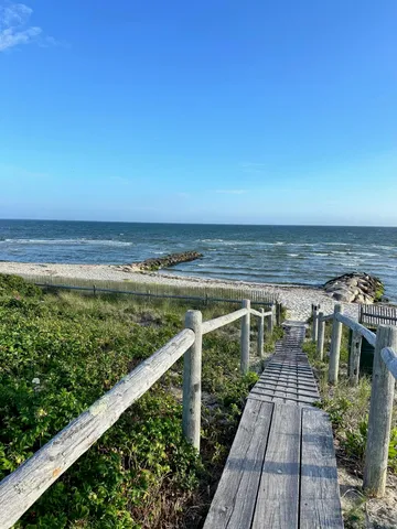 a view of a balcony with an ocean view