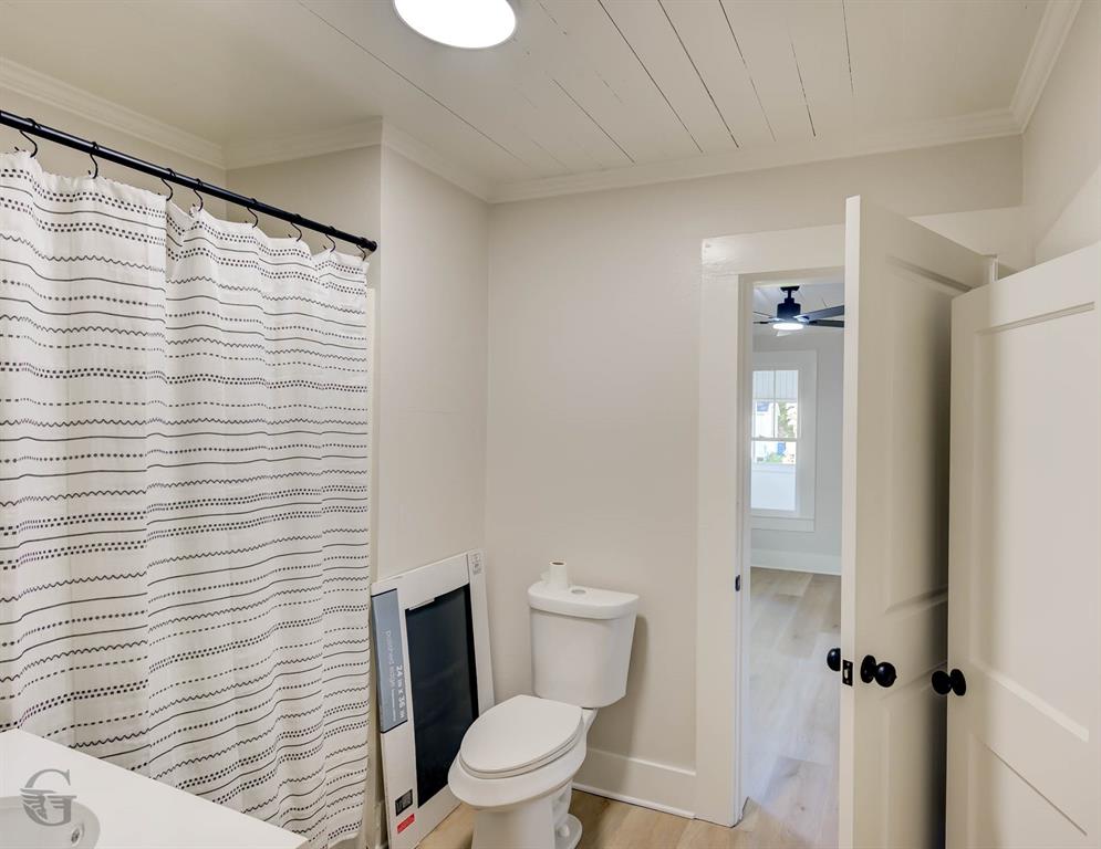 510 Constable Street Minden, LA 71055 - Photo 12 of 18 a white toilet sitting next to a window