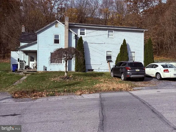 a view of a car parked in front of a house