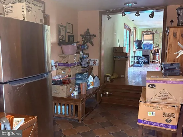 a view of living room with furniture and a window