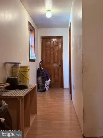 a bathroom with a toilet a sink and a window