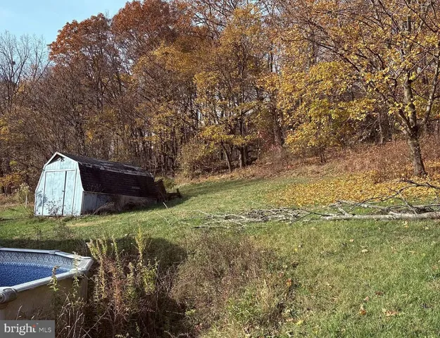 a backyard of a house with lots of green space