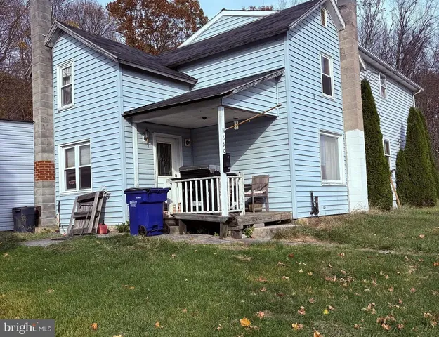 a backyard of a house with seating space