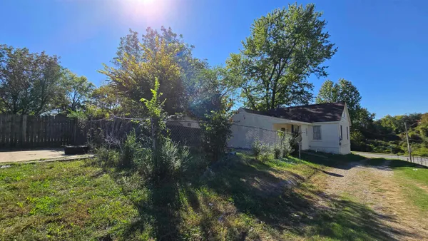 a backyard of a house with lots of green space
