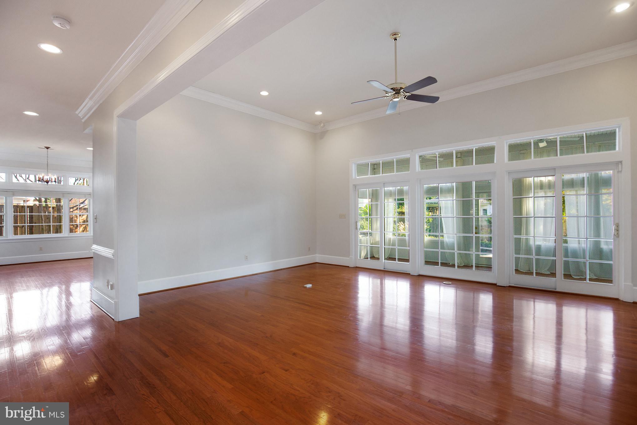 14270 Solomons Island Road South Solomons, MD 20688 - Photo 11 of 30 a view of an empty room with wooden floor and a window