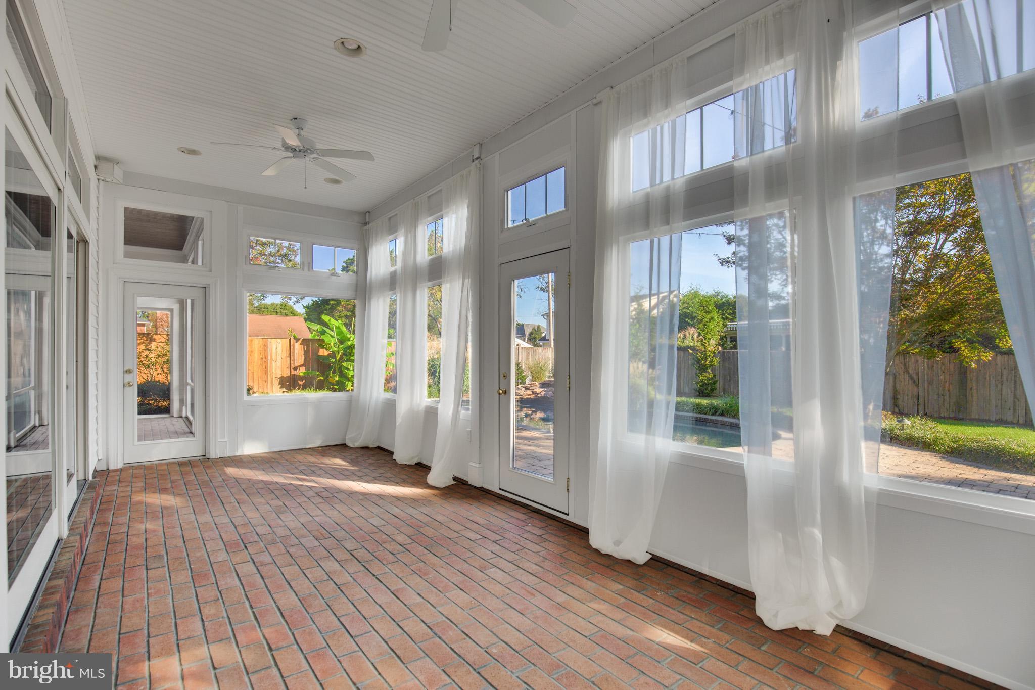 14270 Solomons Island Road South Solomons, MD 20688 - Photo 12 of 30 a view of an entryway with wooden floor and door