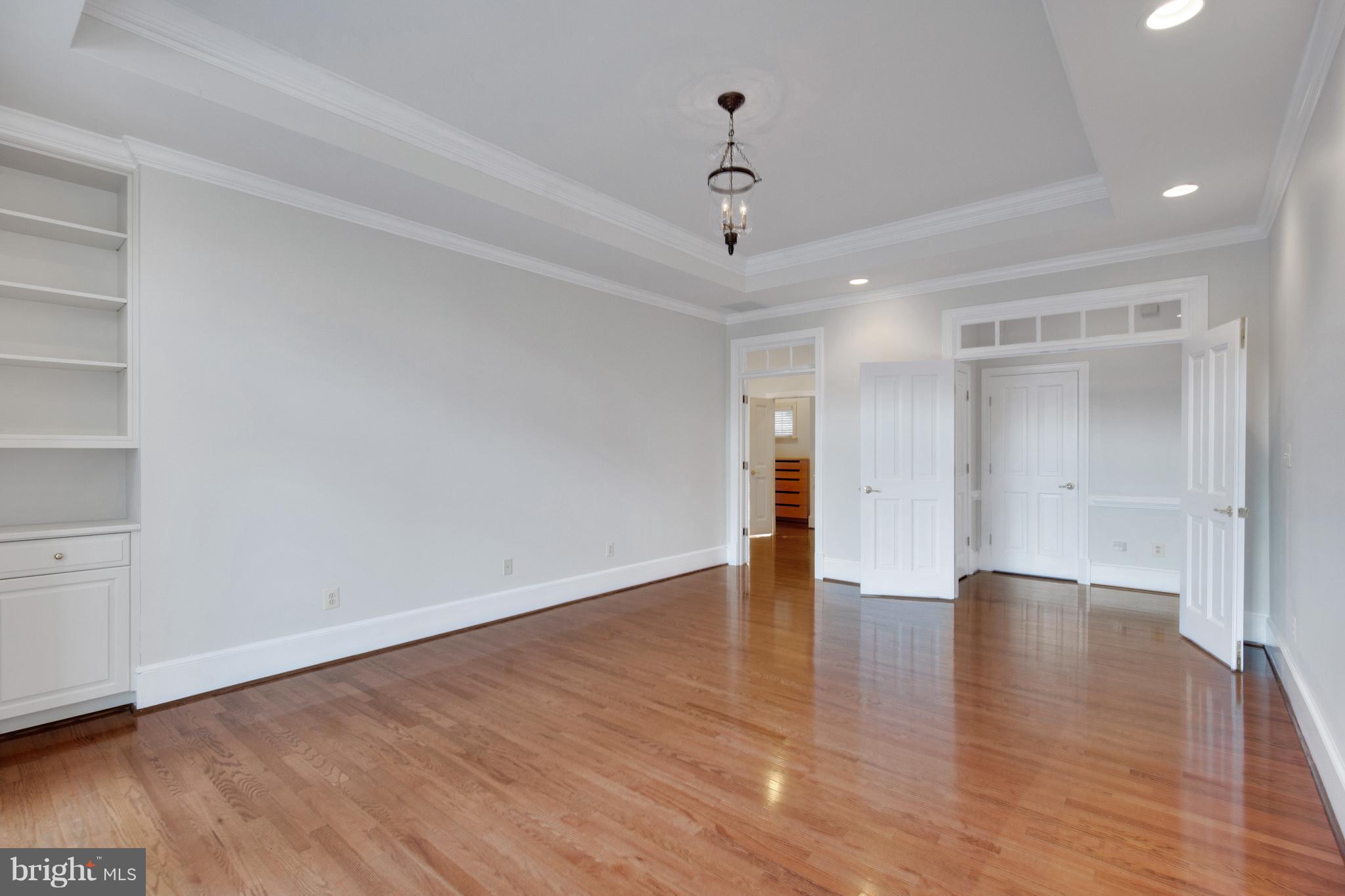 14270 Solomons Island Road South Solomons, MD 20688 - Photo 13 of 30 a view of an empty room with wooden floor