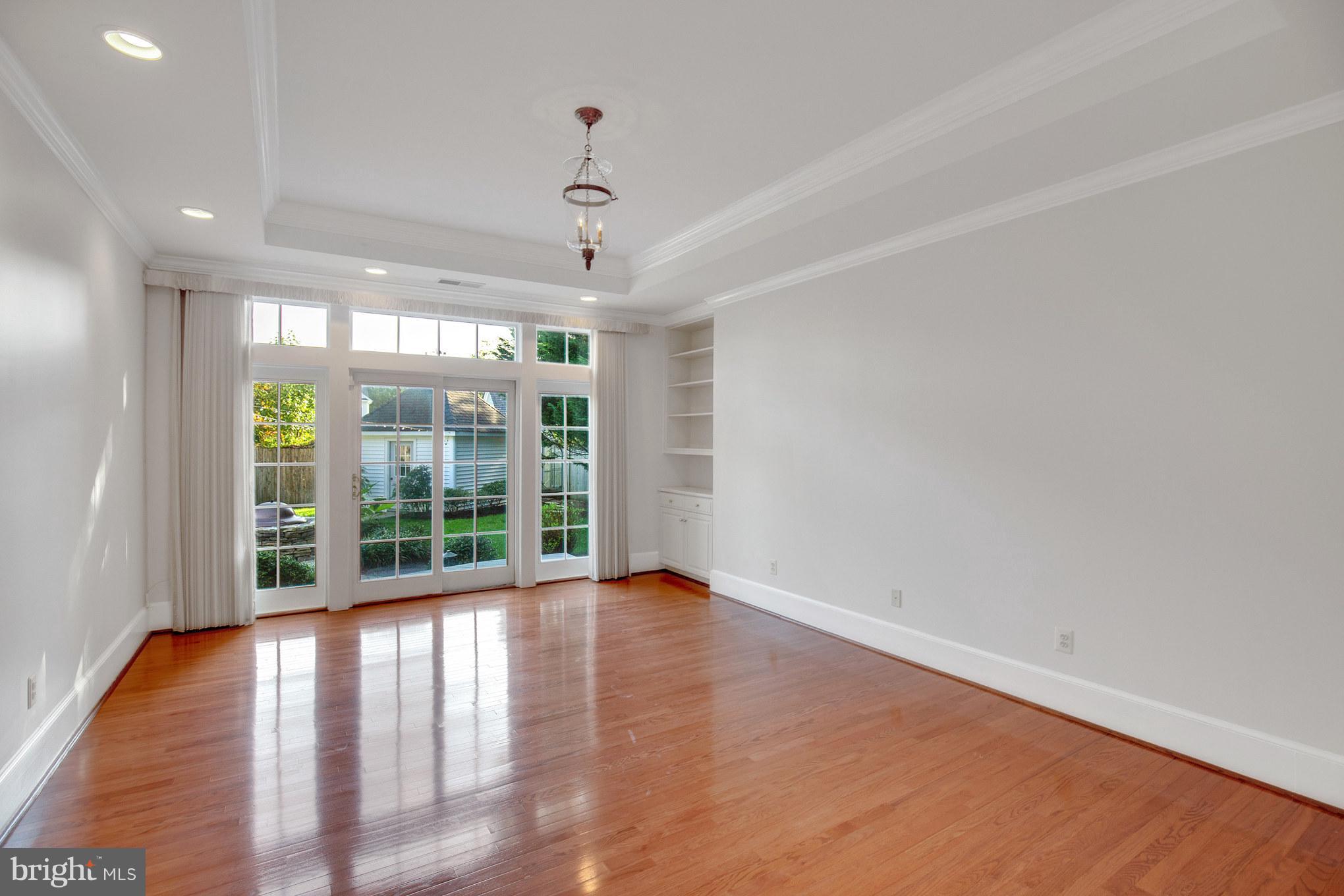 14270 Solomons Island Road South Solomons, MD 20688 - Photo 14 of 30 a view of an empty room with wooden floor and a window