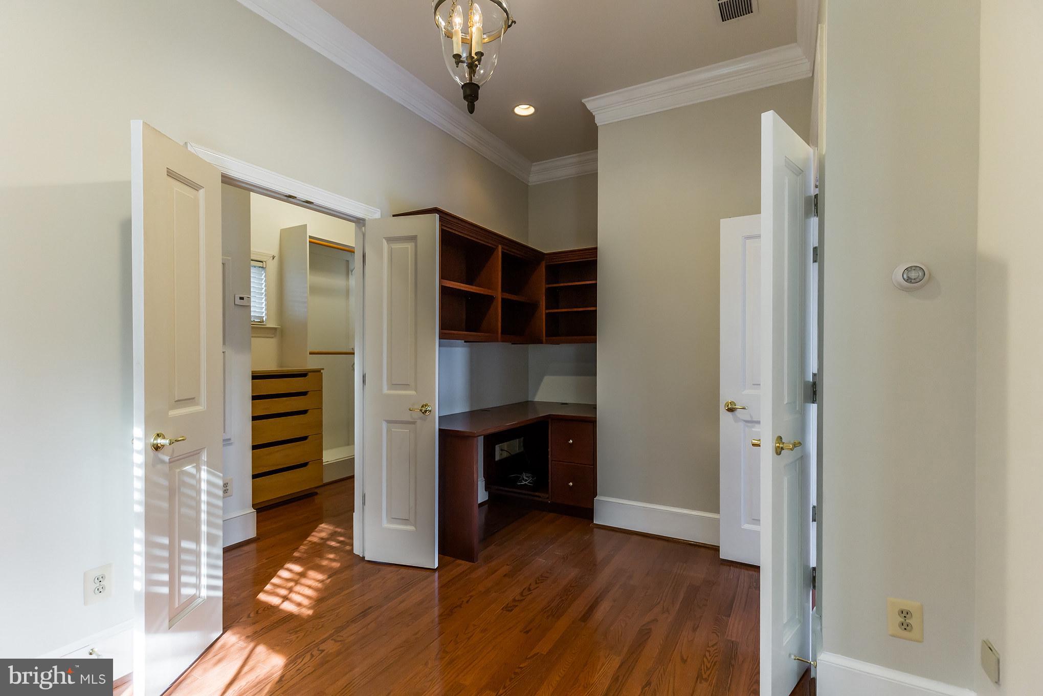 14270 Solomons Island Road South Solomons, MD 20688 - Photo 15 of 30 a view of an empty room with wooden floor and entryway