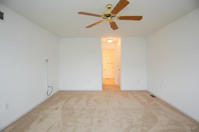 4162 Walter Road Bethlehem, PA 18020 - Photo 22 of 35 an empty room with a window and a ceiling fan