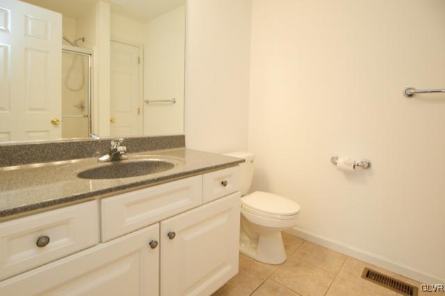 4162 Walter Road Bethlehem, PA 18020 - Photo 23 of 35 a bathroom with a sink a toilet and a mirror
