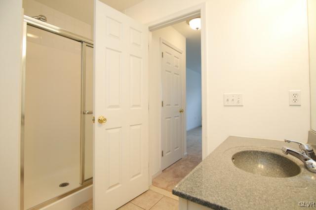 4162 Walter Road Bethlehem, PA 18020 - Photo 24 of 35 a bathroom with a granite countertop sink and shower