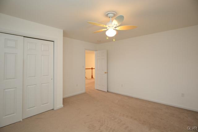 4162 Walter Road Bethlehem, PA 18020 - Photo 30 of 35 an empty room with a chandelier fan and closet area