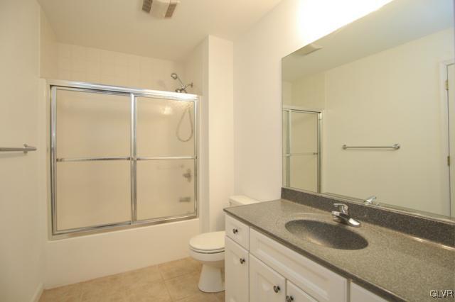 4162 Walter Road Bethlehem, PA 18020 - Photo 31 of 35 a bathroom with a granite countertop sink toilet and shower