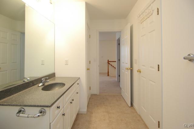 4162 Walter Road Bethlehem, PA 18020 - Photo 32 of 35 a bathroom with a granite countertop sink and a mirror