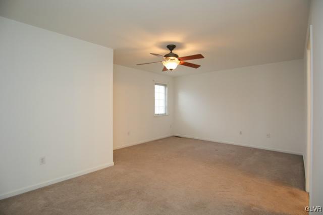 4162 Walter Road Bethlehem, PA 18020 - Photo 34 of 35 an empty room with windows and chandelier fan