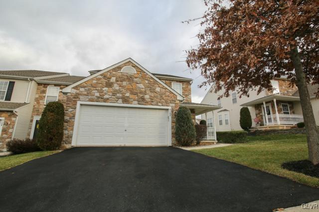 4162 Walter Road Bethlehem, PA 18020 - Photo 4 of 35 a front view of a house with a garden and yard