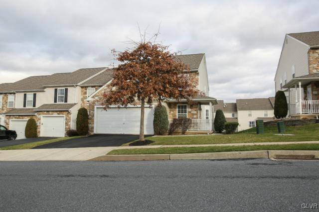 4162 Walter Road Bethlehem, PA 18020 - Photo 5 of 35 a front view of a house with a garden and trees