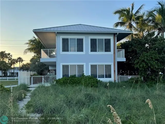 a house view with a garden space