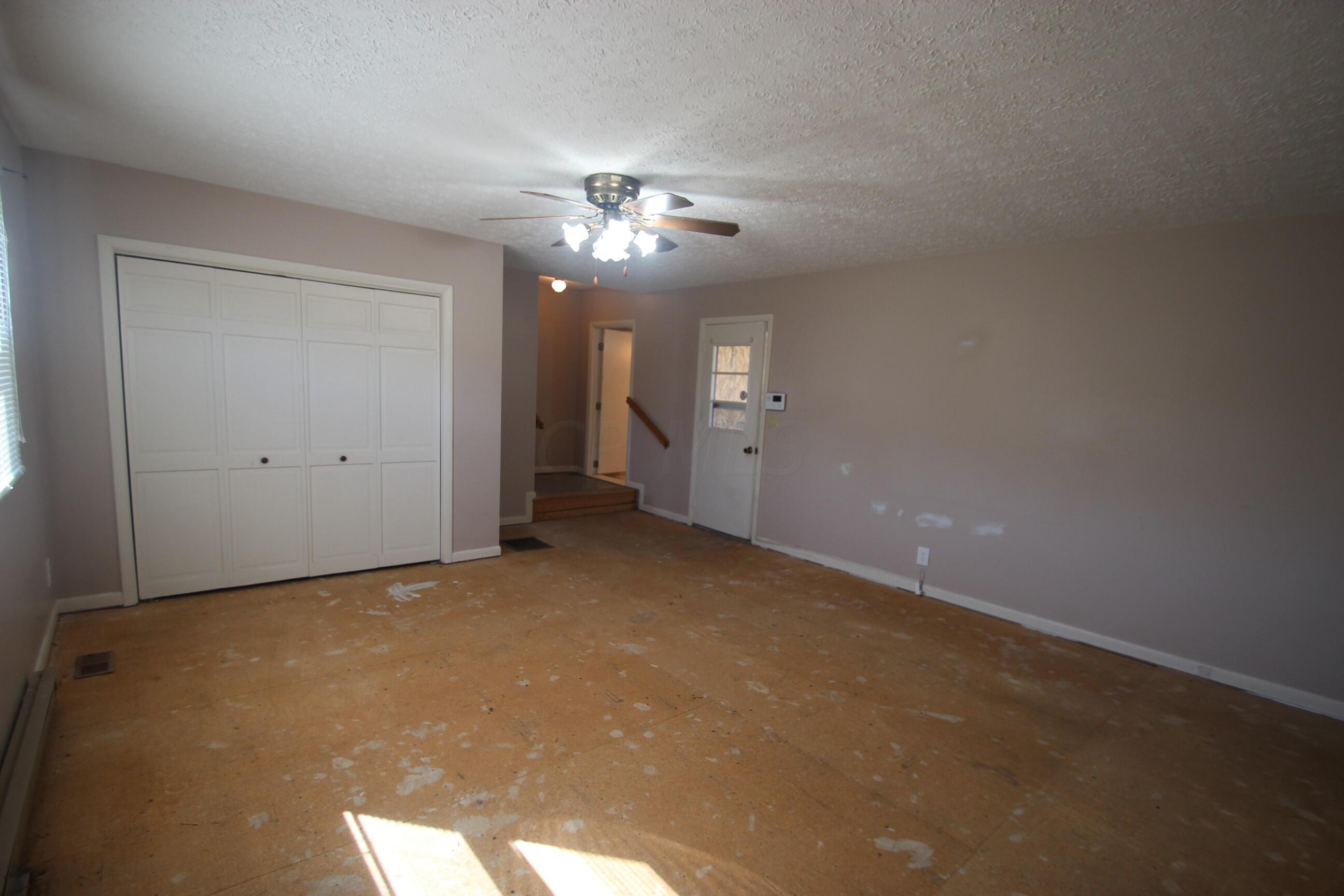 540 Newmans-Cardington Road West Prospect, OH 43342 - Photo 33 of 41 Family room toward kitchen and from screened in porch.