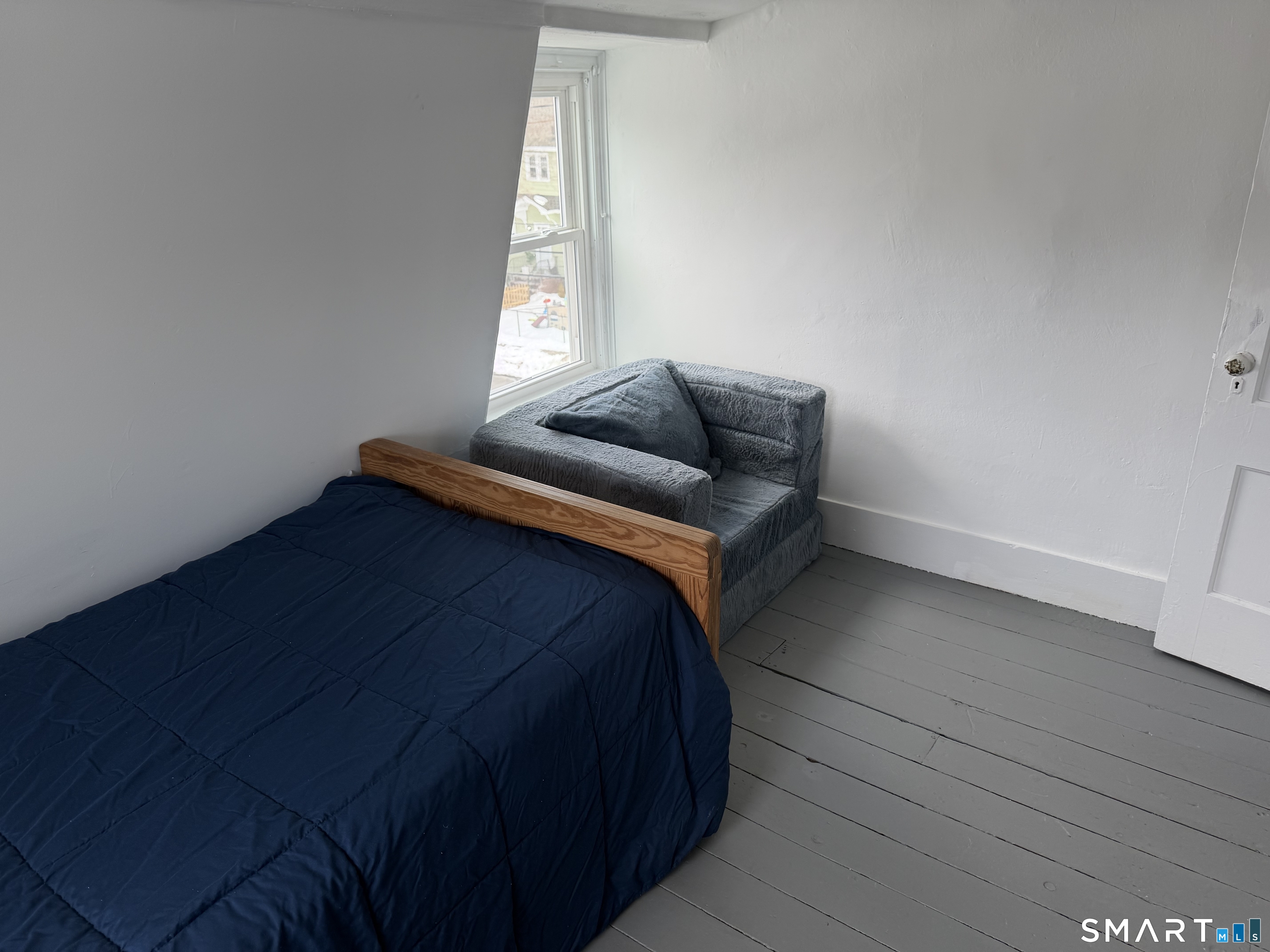 246 Ledyard Street New London, CT 06320 - Photo 33 of 40 Located on Third Floor - Twin Bed with Chair