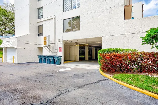 a view of a garden with a building in the background