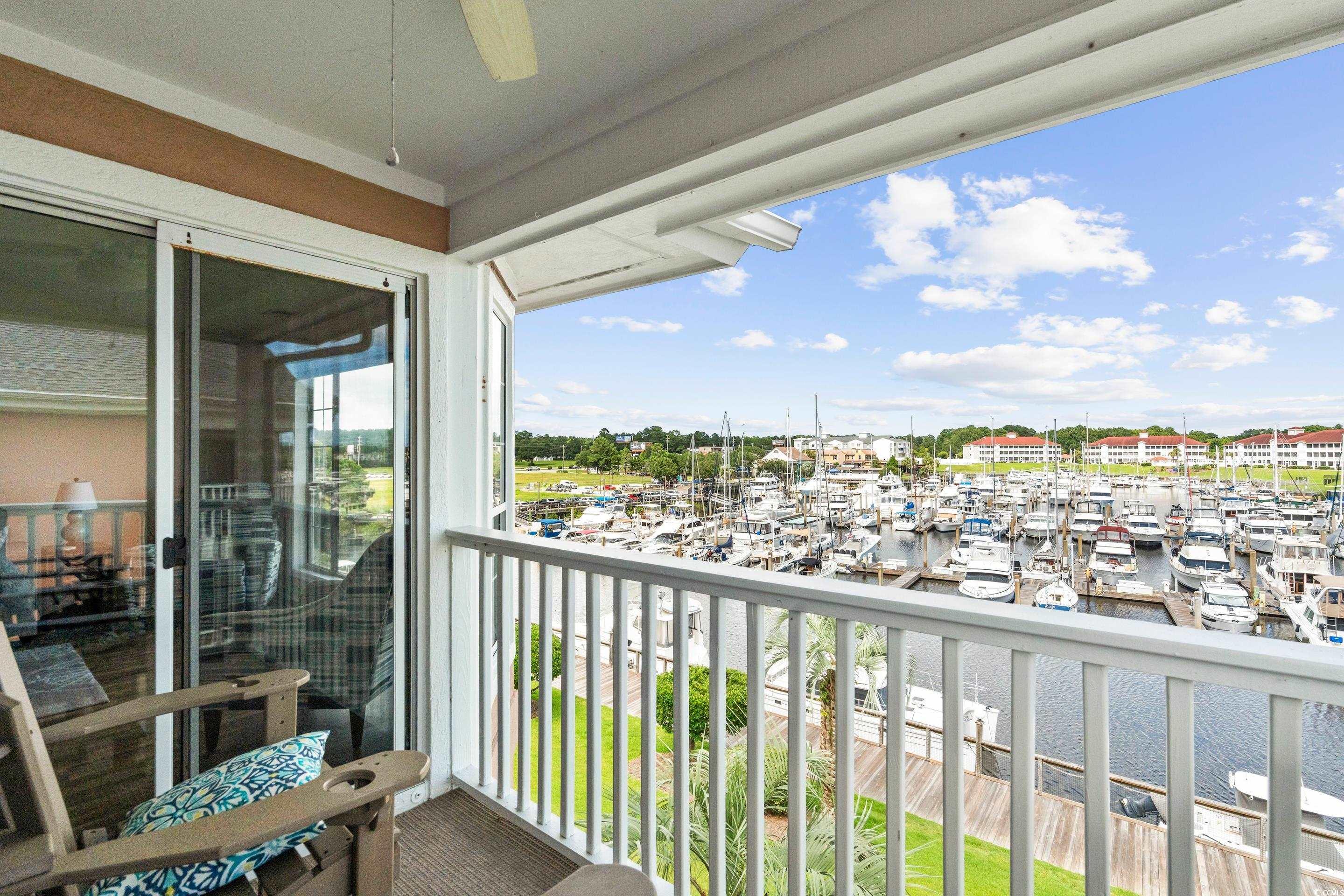 4629 Lightkeepers Way, Unit 6L Little River, SC 29566 - Photo 13 of 36 Balcony featuring view of marina, a water view, and ceiling fan