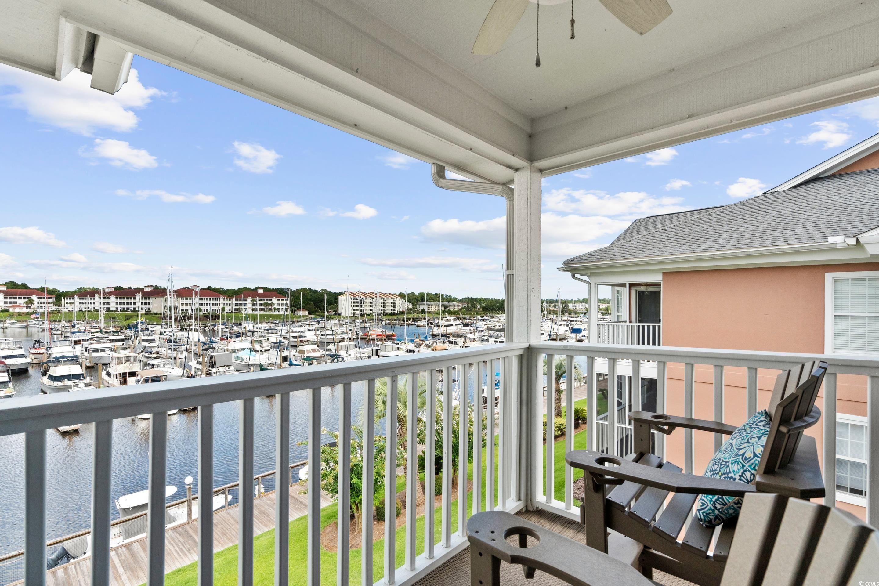 4629 Lightkeepers Way, Unit 6L Little River, SC 29566 - Photo 14 of 36 Balcony with view of marina, a water view, ceiling fan, and a sunroom