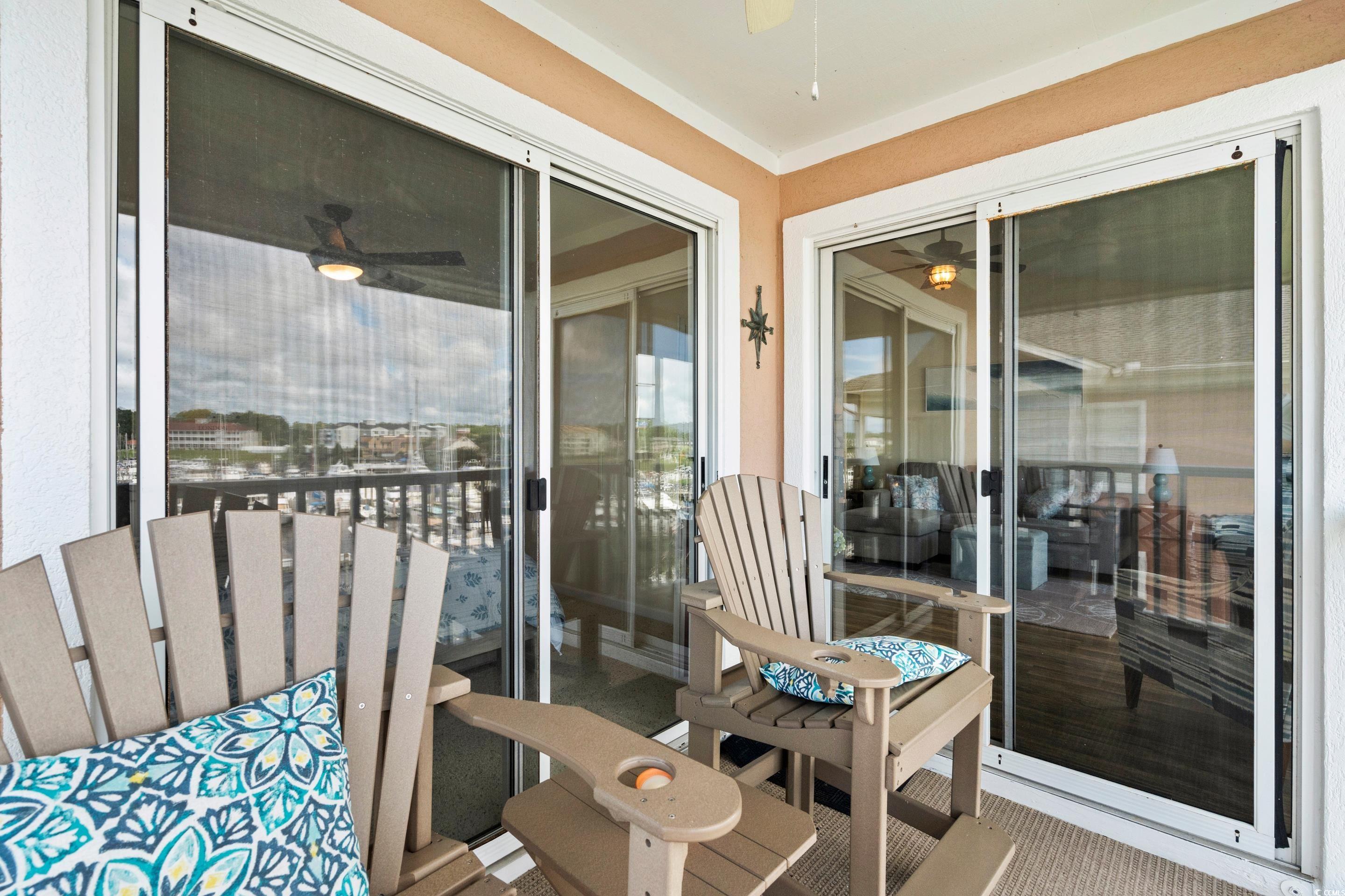 4629 Lightkeepers Way, Unit 6L Little River, SC 29566 - Photo 15 of 36 Balcony with a ceiling fan