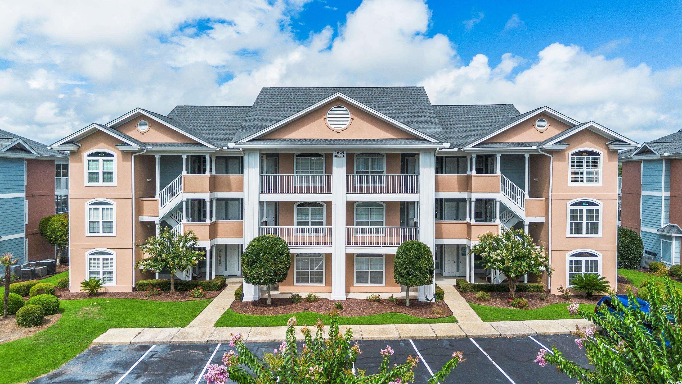 4629 Lightkeepers Way, Unit 6L Little River, SC 29566 - Photo 2 of 36 View of property featuring uncovered parking