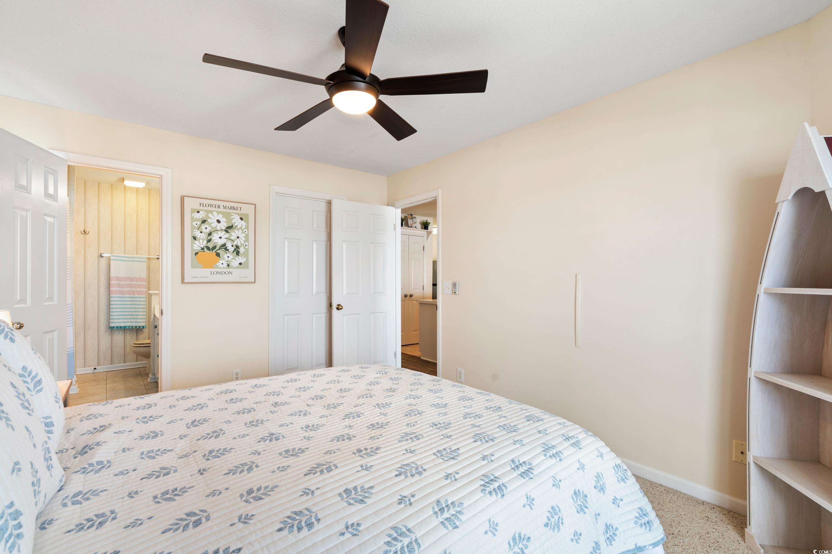 4629 Lightkeepers Way, Unit 6L Little River, SC 29566 - Photo 19 of 36 Bedroom with ceiling fan and a closet